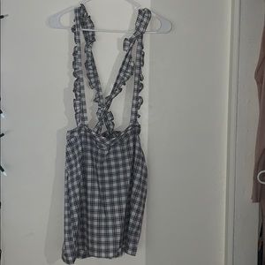 Overall skirt from Forever 21; crosses in the back